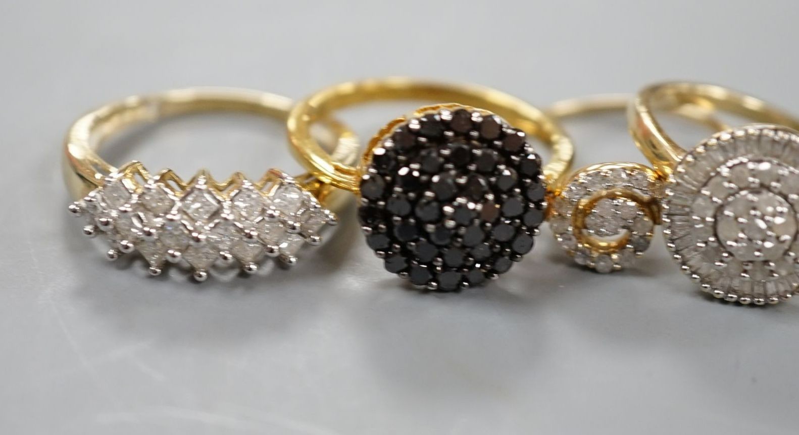 Four assorted modern 9ct gold and white or coloured diamond cluster set dress rings and two similar rings set in gilt 925